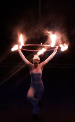 fire hula hoop girl entertains in Vietnam from Australian troupe will-o'-the-Wisp circus arts