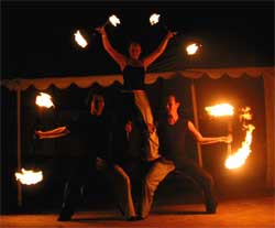 fire spinning, human pyramid, base, fire staff