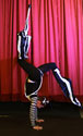 Eve Everard performs a stilt acrobatic walkover